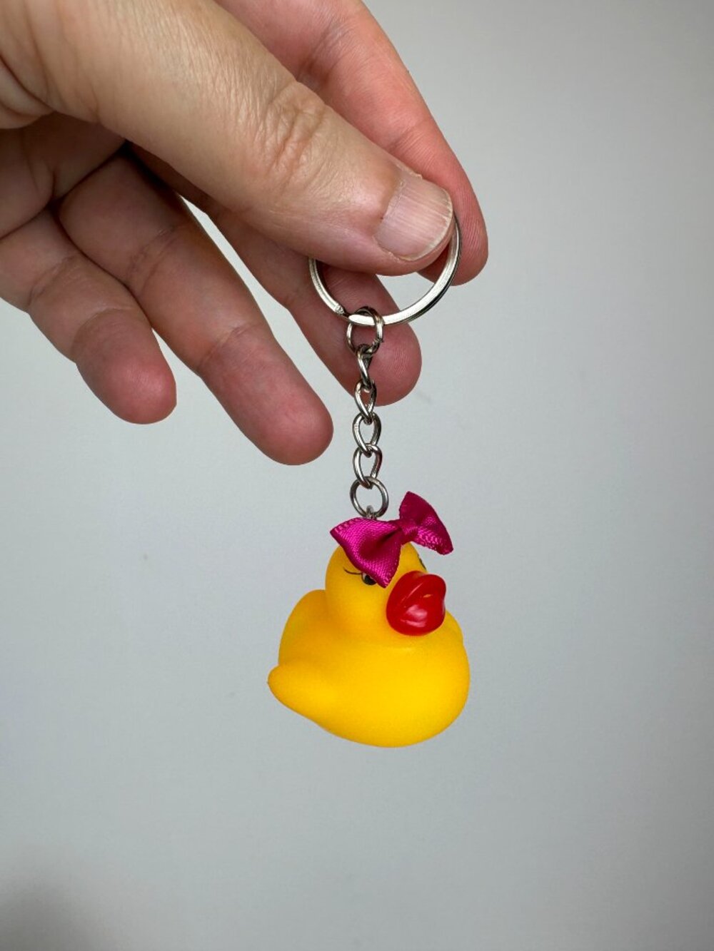 Cute fun yellow rubber duck keychain with pink bow and oversized red lips. New